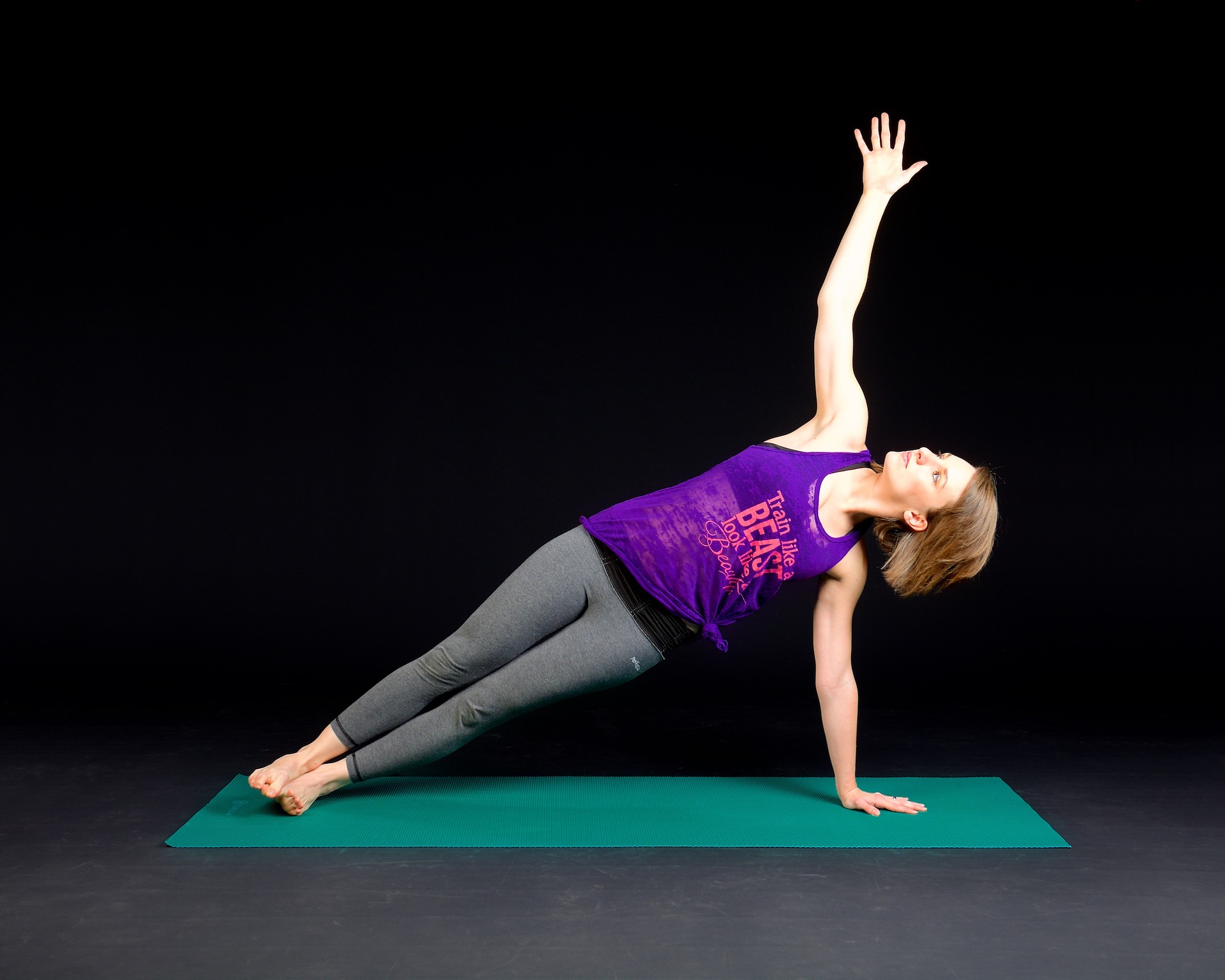 image of woman doing a yoga stretch